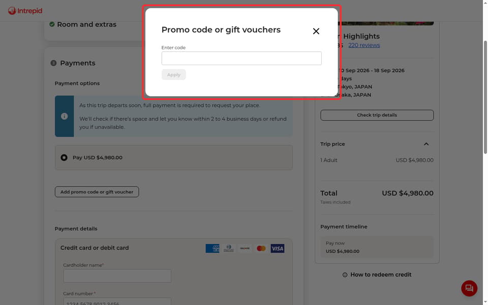 Intrepid Travel checkout page showing the Enter code field and Apply button