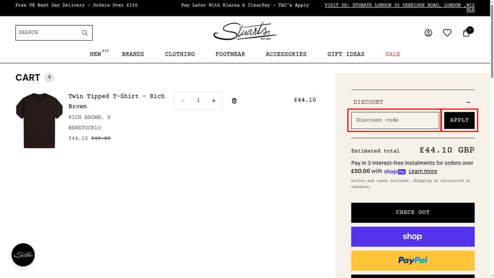 Stuarts London checkout page showing the Discount code field and Apply button